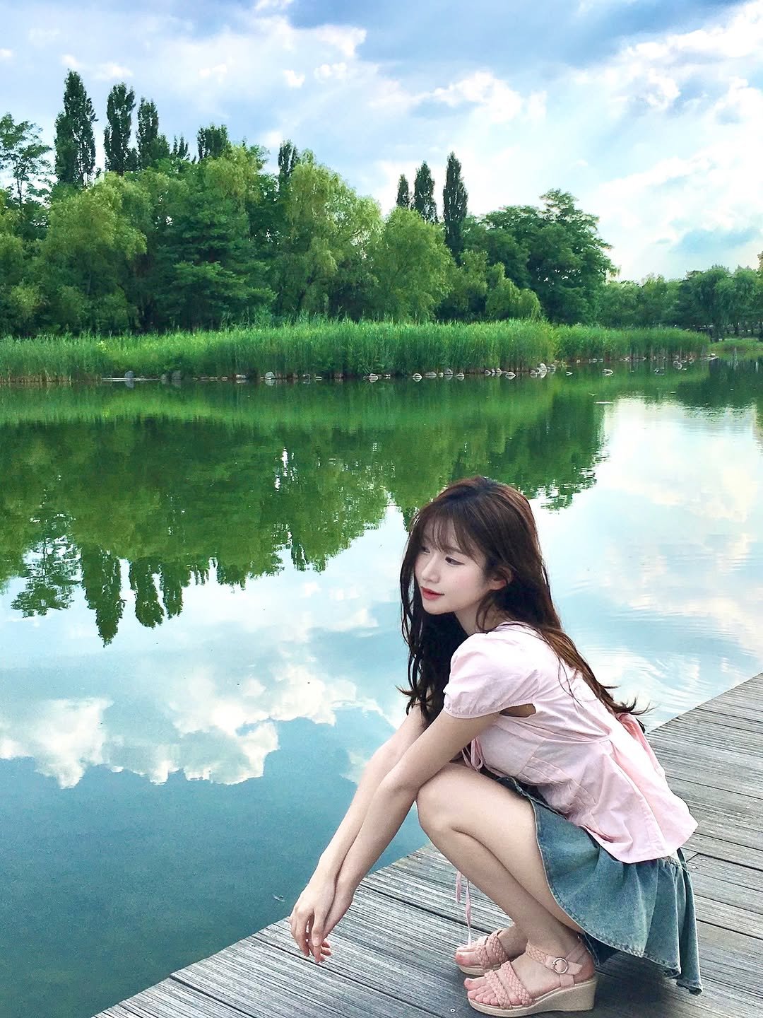 Photo by 이로아 on July 15, 2025. May be an image of 1 person, lake and text.