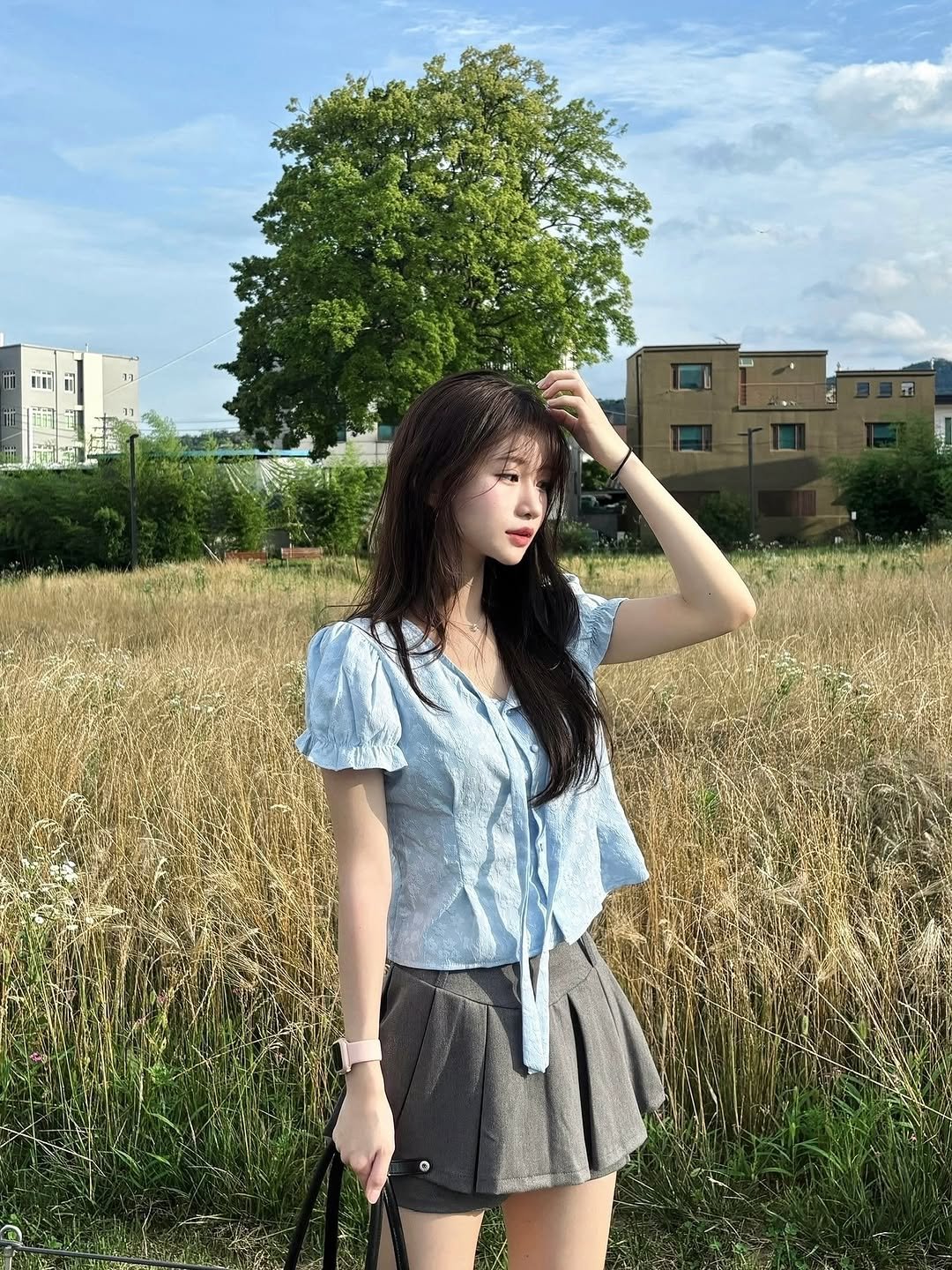 Photo by 이로아 on July 05, 2025. May be an image of 1 person, shorts, skirt, top, grass and text.