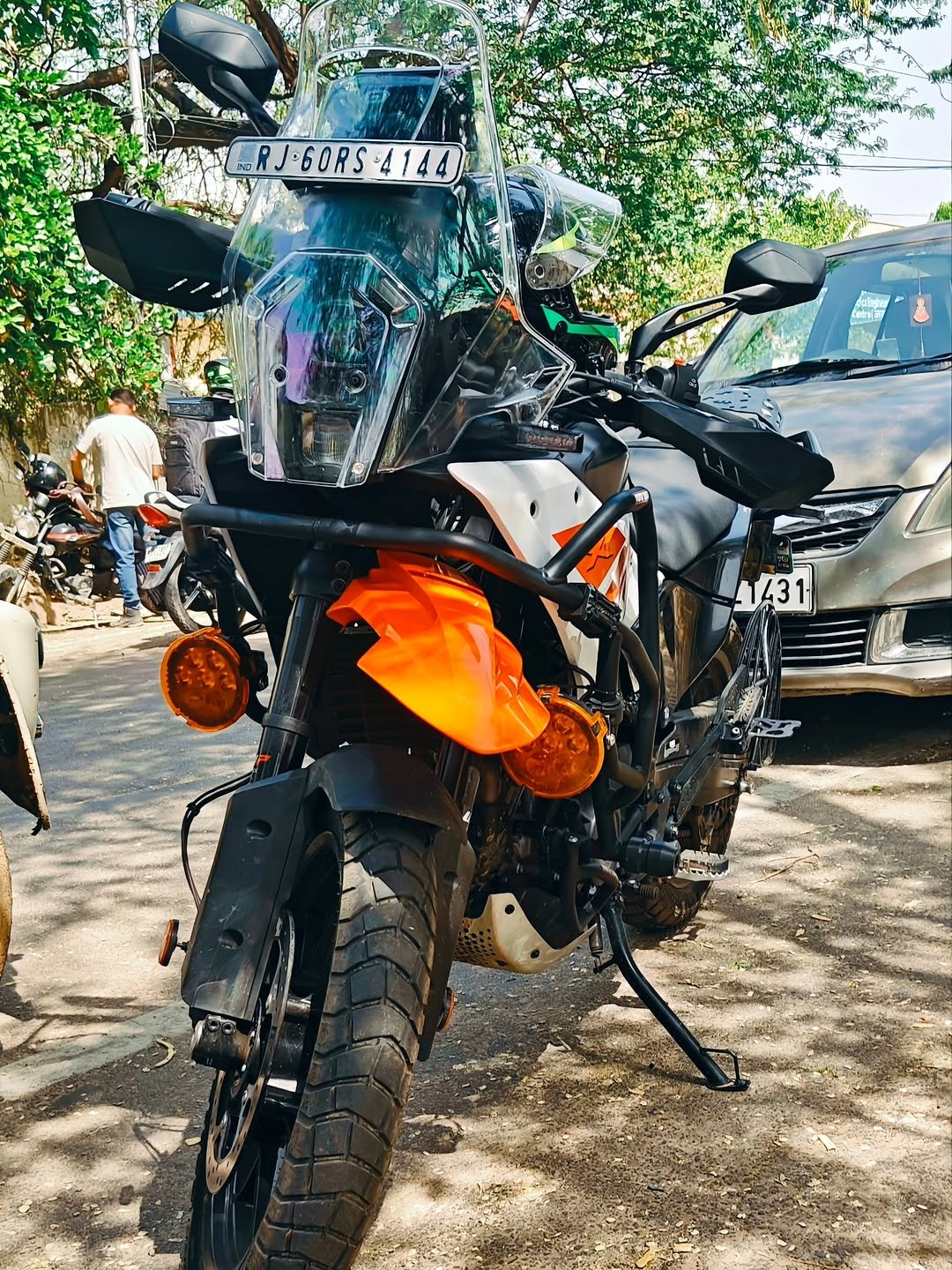 Photo by KANHAIYA SHARMA on April 27, 2026. May be an image of motorcycle, dirt bike, glasses, helmet, scooter and text that says 'មន SRA RJ.60RS RJ.60RS4144 •6ORS 4144 COL bdar 1431'.