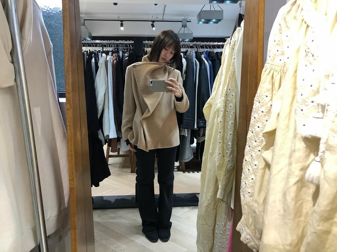 Photo shared by kimyoung on January 22, 2026 tagging @heidemarie_co. May be an image of duffle coat, sable coat, overcoat, clothes hanger and text.