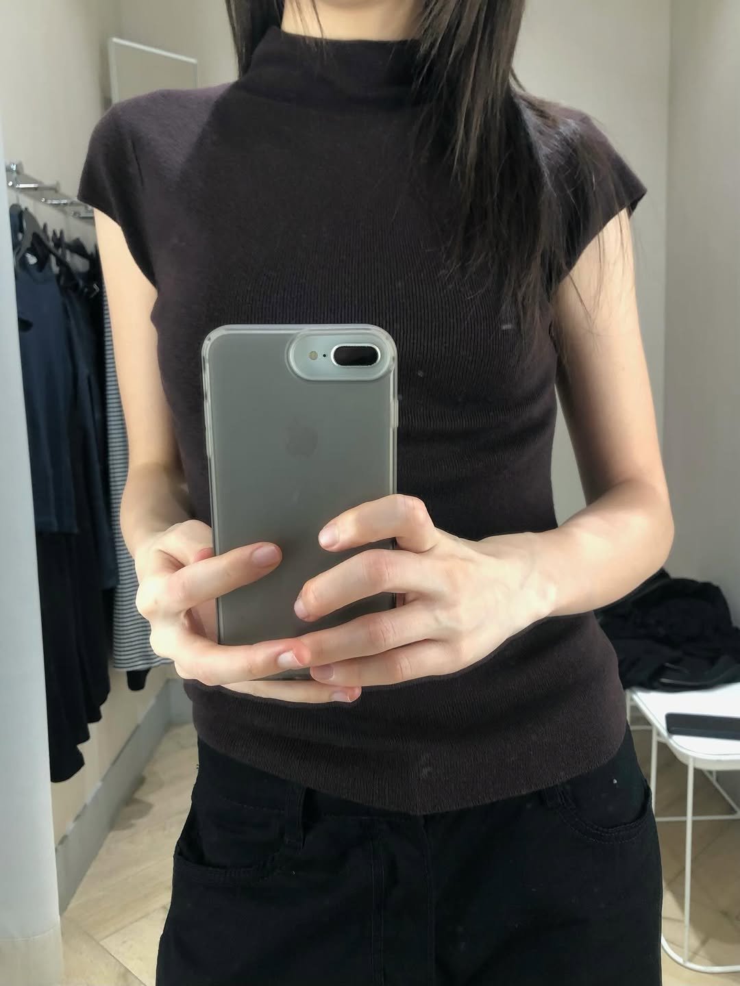 Photo by kimyoung on March 11, 2026. May be an image of clothes hanger, top, turtleneck and text.