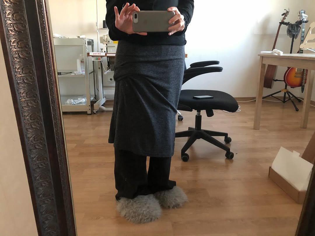 Photo shared by kimyoung on November 23, 2025 tagging @noohaseoul. May be an image of sweatpants, kilt and text.