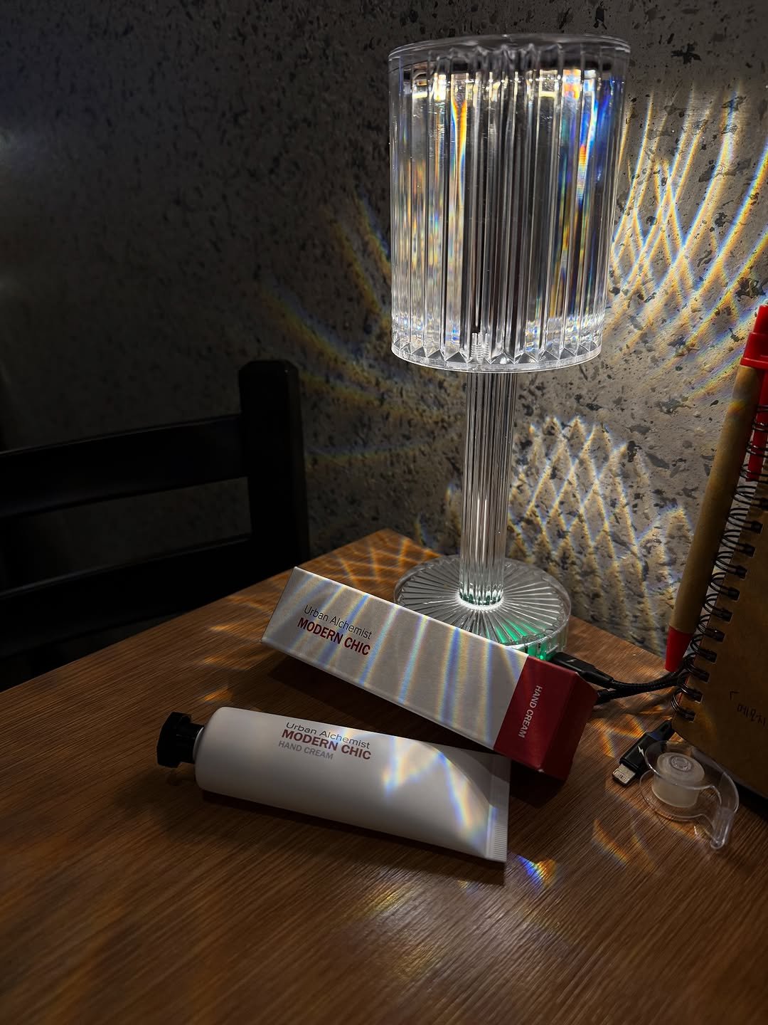 Photo shared by 황소영ᰔ ྀིྀིྀིྀིྀ on August 08, 2025 tagging @urbanalchemist_official. May be an image of lighting, lamp, lightbulb, lamp shade, hand cream and text that says 'MODERN MDCHC MODED Aich ich MANDCRE MODERN CHIC ובהרצ CH'.