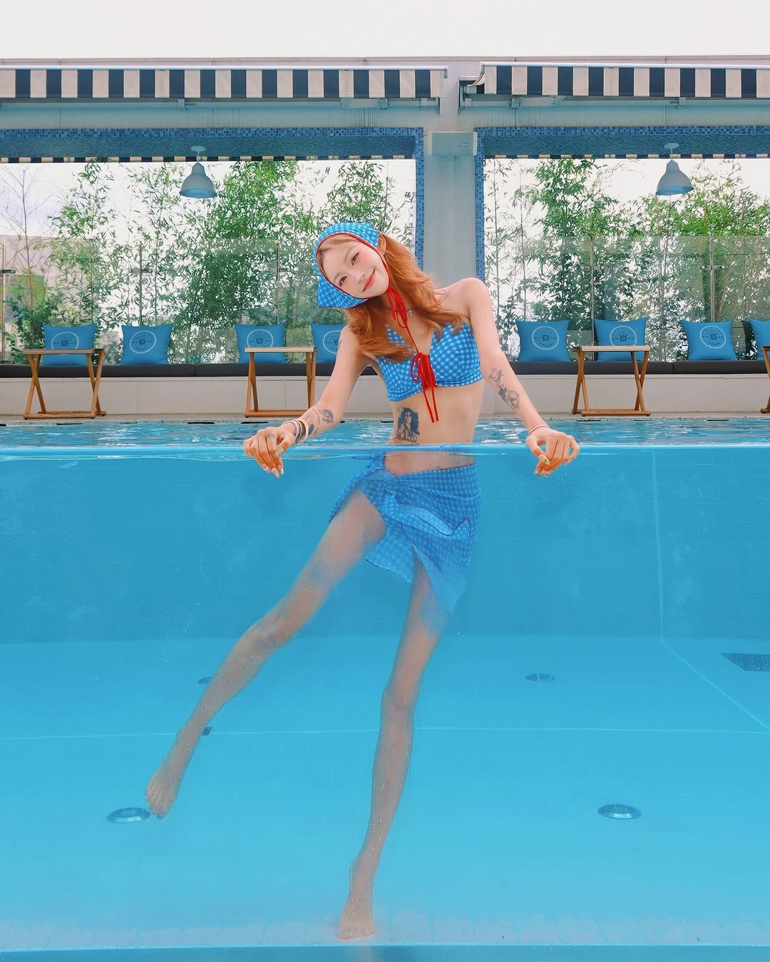 Photo by ָ 「 준희 」 on July 30, 2025. May be an image of 1 person, swimming, glasses, pool and text.
