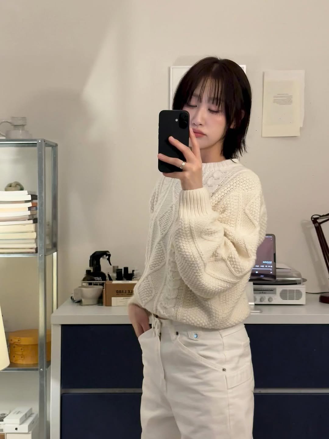 Photo by 은혜 on November 16, 2025. May be an image of one or more people, bangs, sweater, top, turtleneck, cardigan and text.