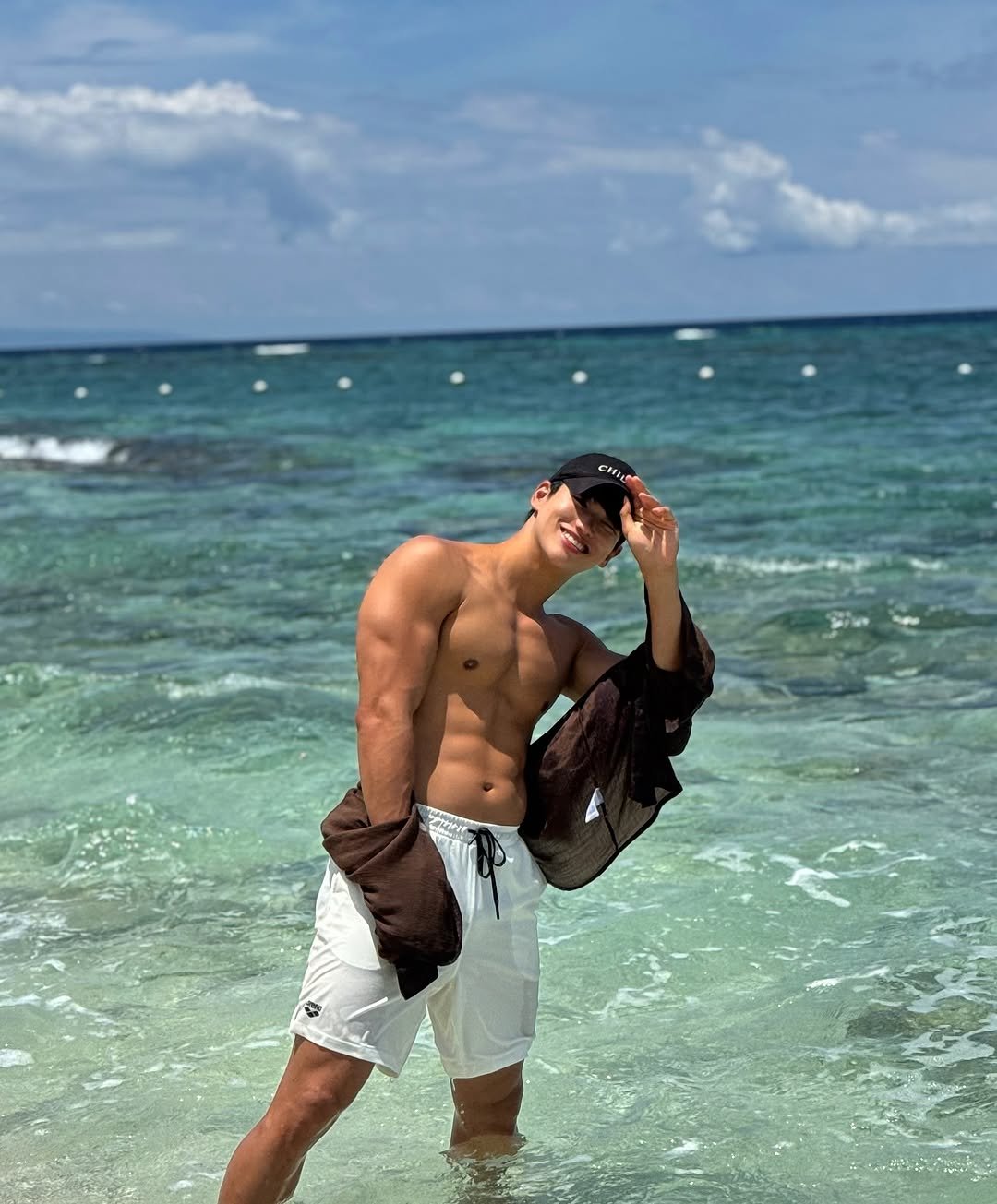 Photo by 김예현 on September 01, 2025. May be an image of 1 person, towel, sarong, ocean, beach and text.