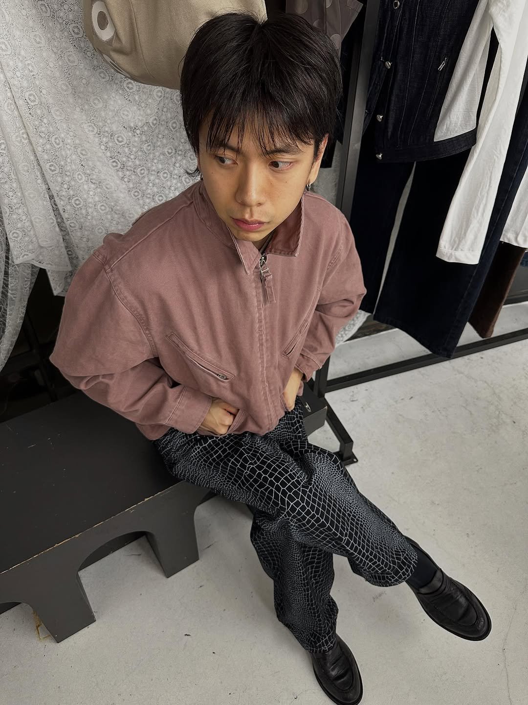 Photo shared by 피로 on October 24, 2025 tagging @fuckingawesome, and @poptradingcompany. May be an image of child, suit, wingtip shoes and text.