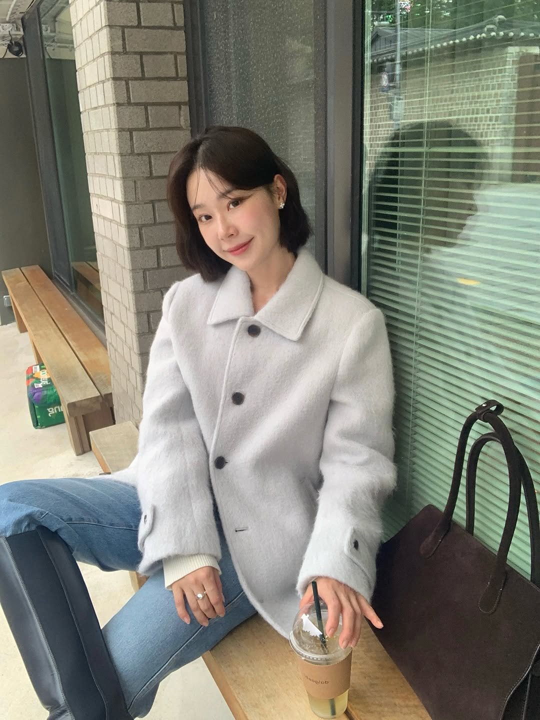 Photo shared by 주미 on October 18, 2025 tagging @fyeo_official. May be an image of duffle coat, overcoat, goosedown coat, jacket, parka, blazer, cornflower and text.