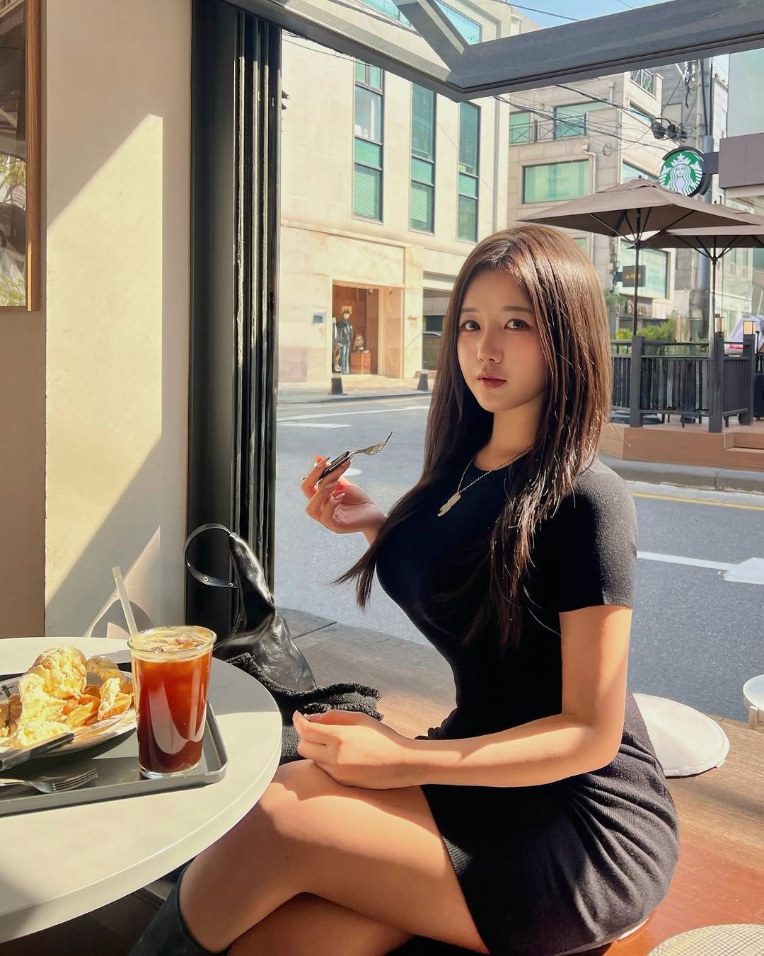 Photo by 지오 on April 05, 2026. May be an image of smoking, miniskirt, cigarette, cornflower and text.