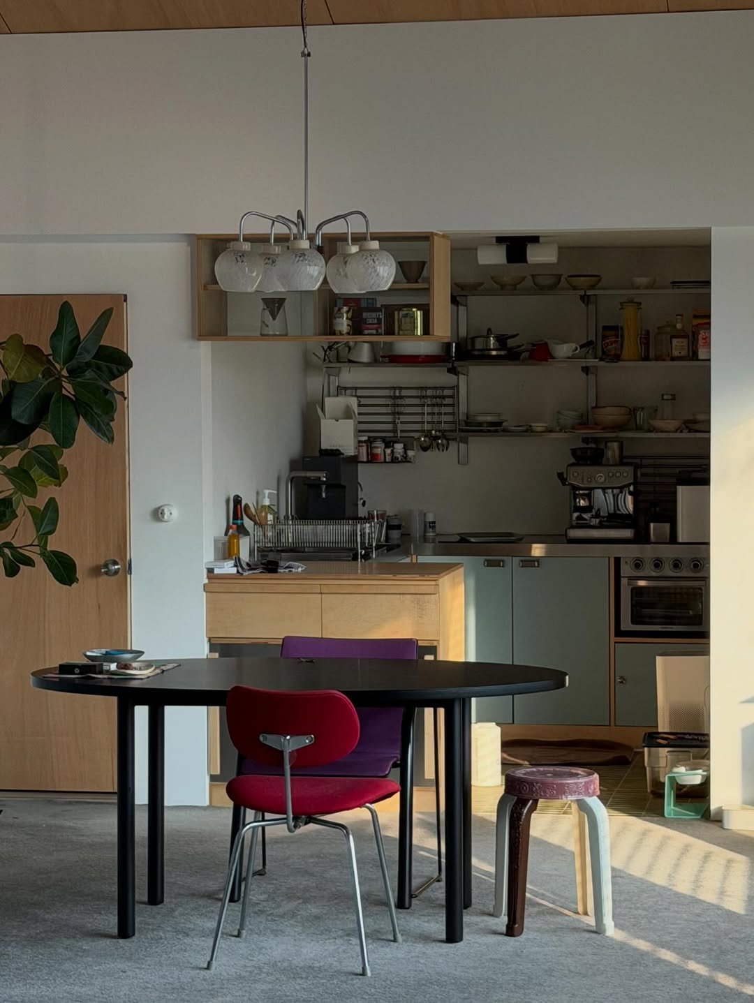 Photo by 2UC inc. on February 09, 2026. May be an image of table, lighting, armchair, dining table, kitchen table, indoors and text.