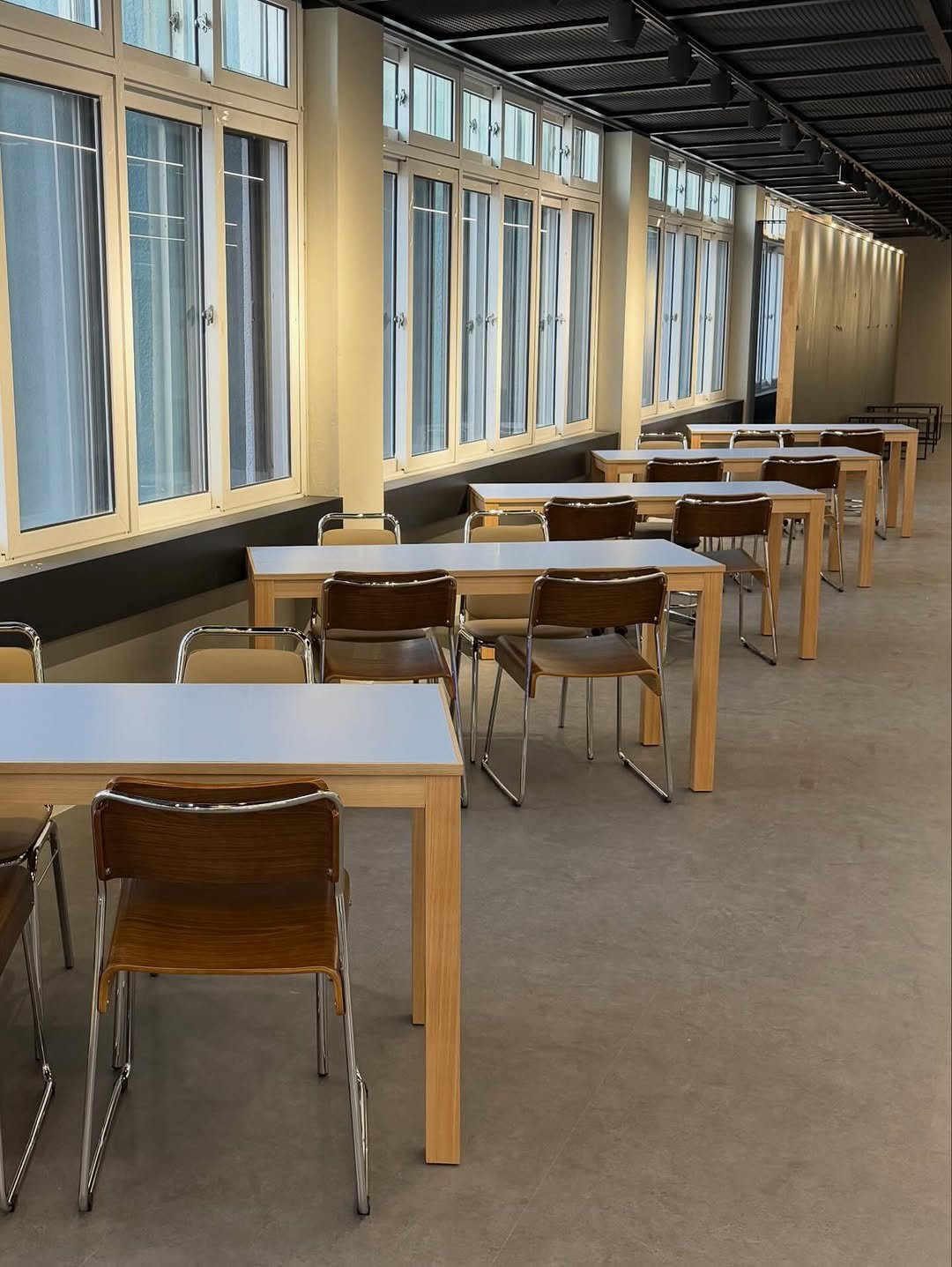 Photo by 2UC inc. on February 25, 2026. May be an image of table, dining table, indoors, office and text.