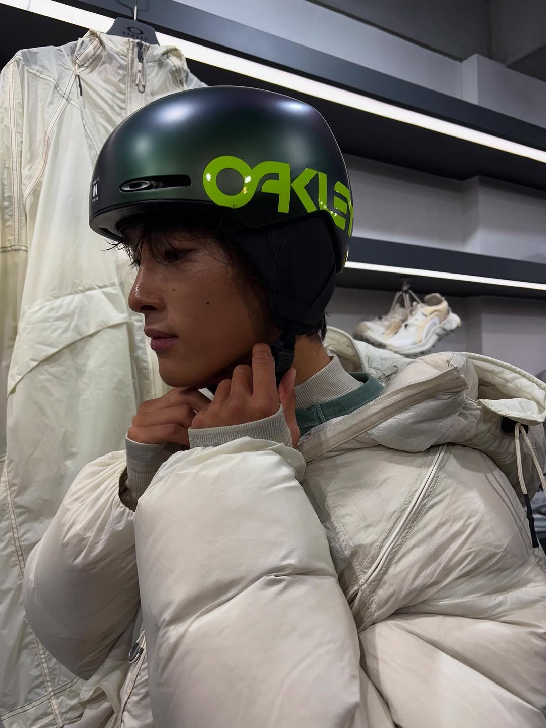 Photo shared by 홍태준 TaeJun on October 10, 2025 tagging @oakley. May be an image of duffle coat, goosedown coat, snowsuit, wetsuit, face mask, parka, helmet, glasses and text.