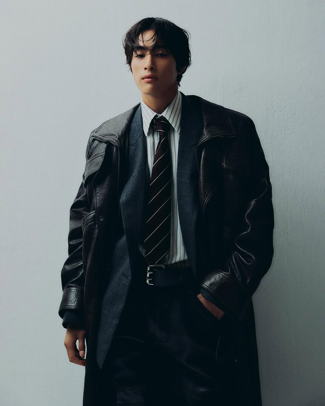 Photo shared by 홍태준 TaeJun on July 29, 2025 tagging @ysl, @kigon_kwak, @hbhan_, @dazedkorea, @kangyoonjin_, and @jeonhoon_. May be an image of 1 person, bangs, duffle coat, overcoat, suit, blazer, bolo tie and text.