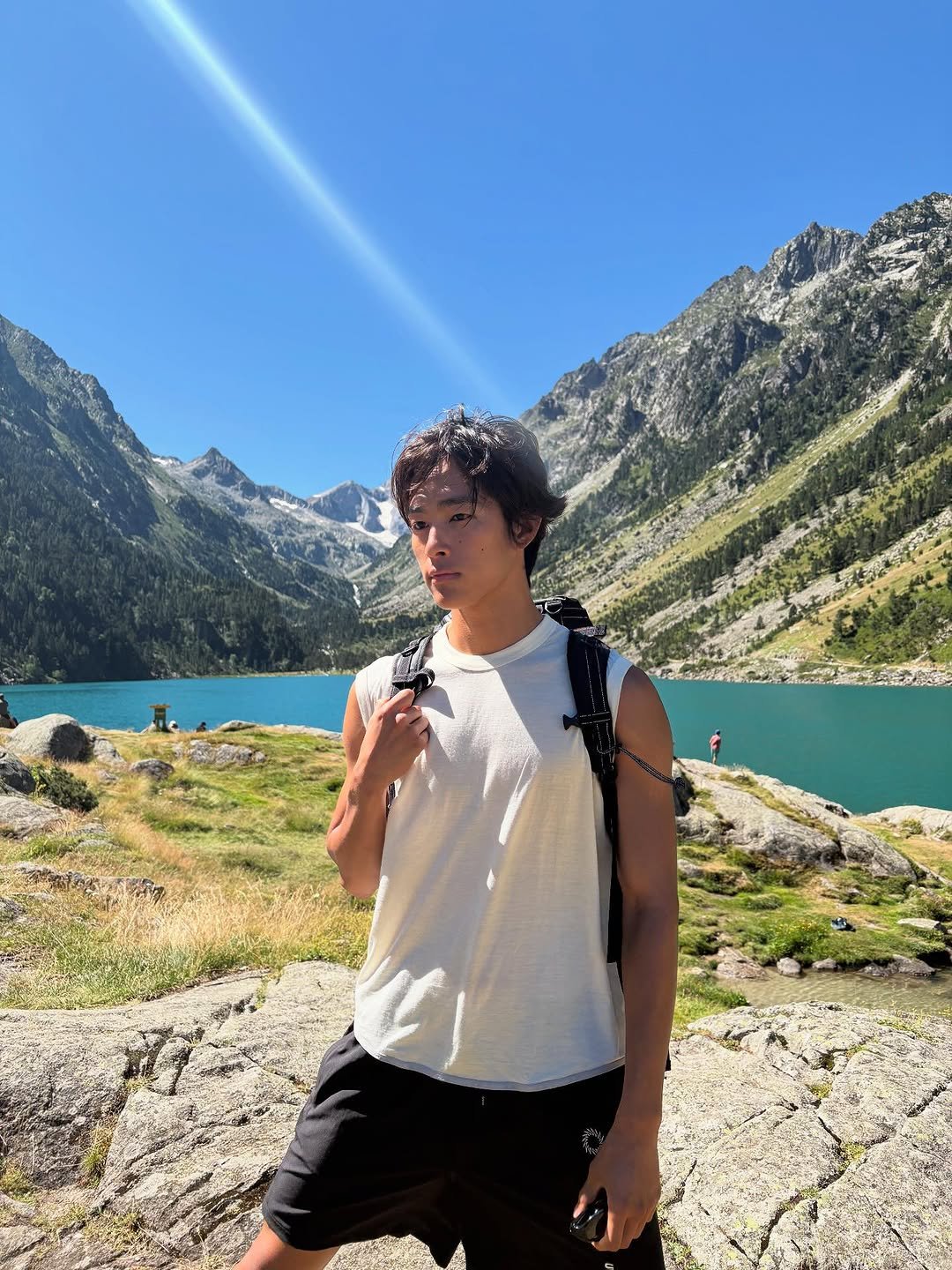 Photo by 홍태준 TaeJun on July 19, 2025. May be an image of 1 person, lake, mountain and text.