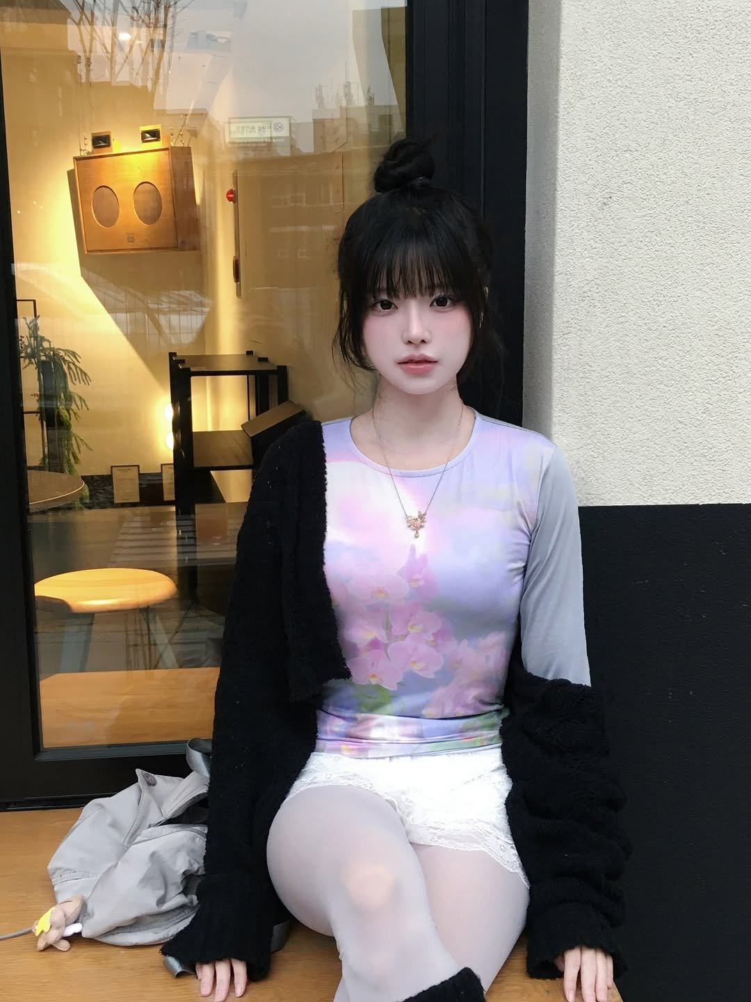 Photo shared by 강비 on December 10, 2025 tagging @_myulip. May be an image of one or more people, hair, tights, miniskirt, dress, turtleneck, fishnet stockings and text.