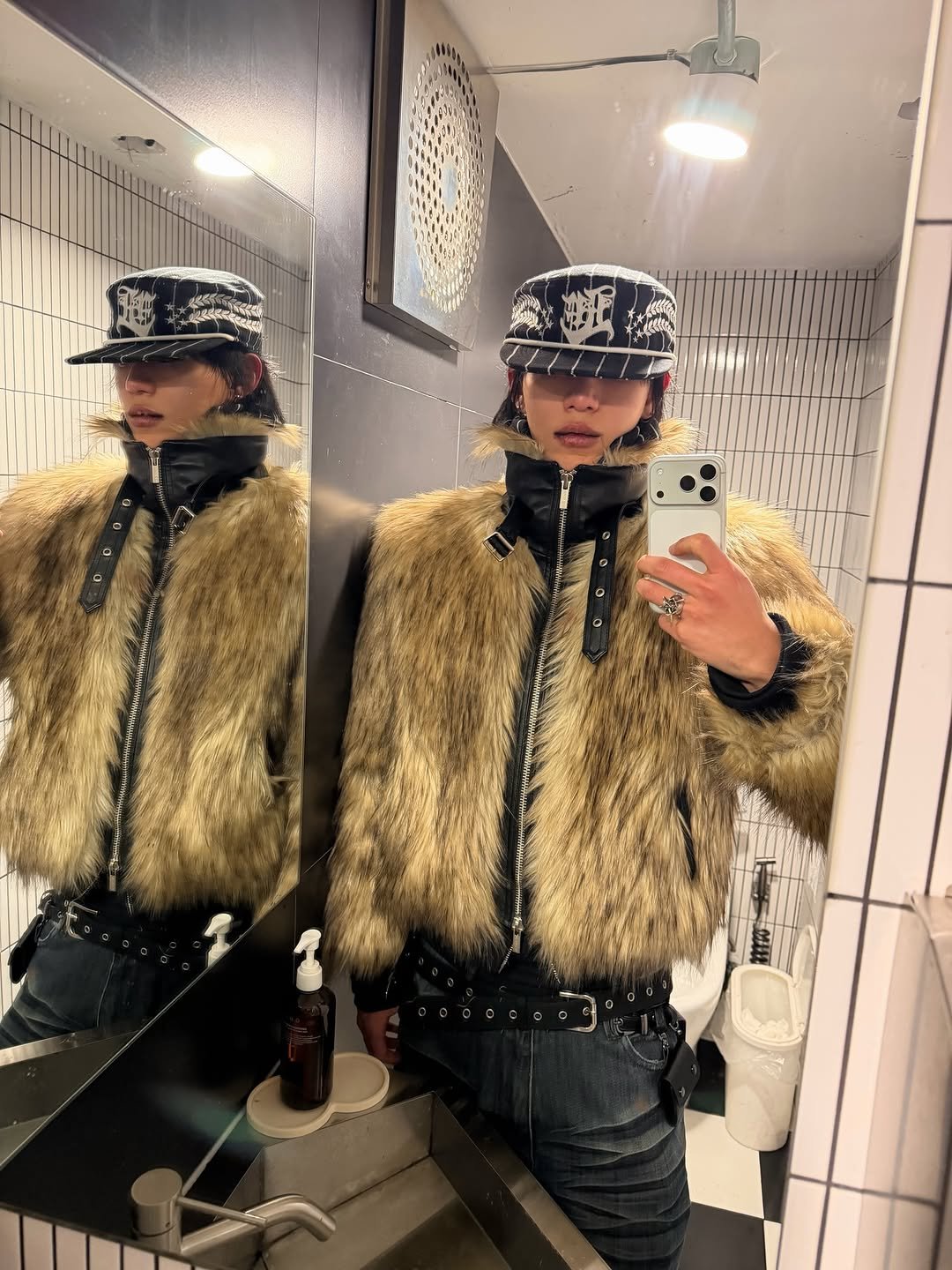 Photo shared by 조우진 on February 09, 2026 tagging @lecyto. May be an image of overcoat, hat, fur coat, goosedown coat, duffle coat, mirror, jacket, parka and text.