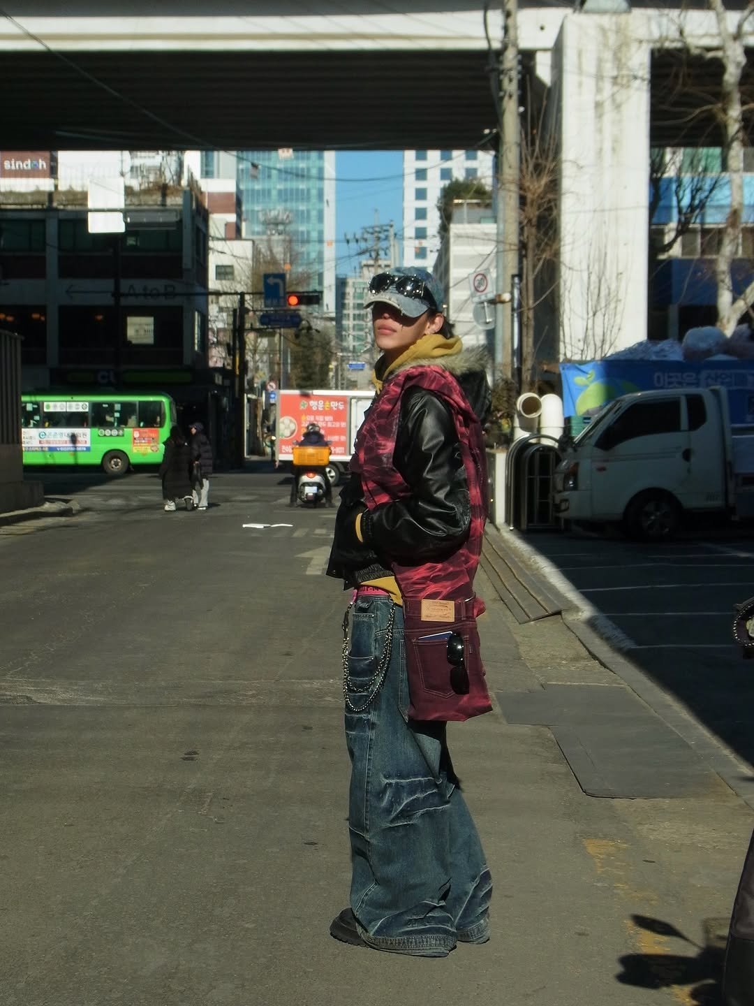 Photo by 조우진 on January 22, 2026. May be an image of standing, kilt, street and text.