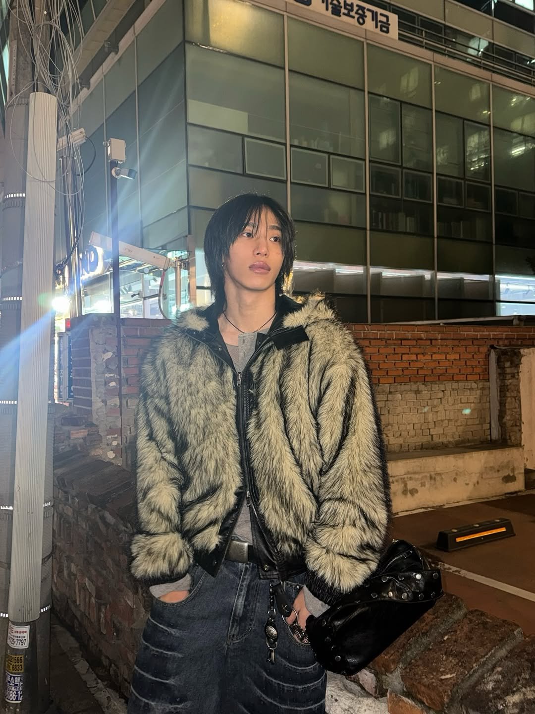 Photo by 조우진 on December 19, 2025. May be an image of overcoat, goosedown coat, duffle coat, jacket, parka and text.