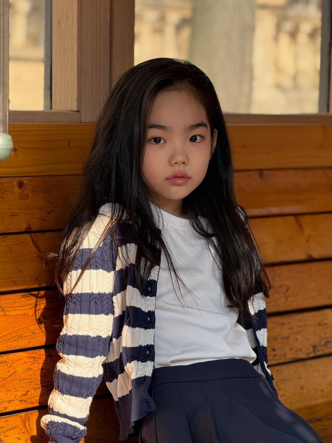 Photo by Hwang sumi_오은서 on March 25, 2026. May be an image of child, hair, duffle coat, turtleneck, cardigan and text.