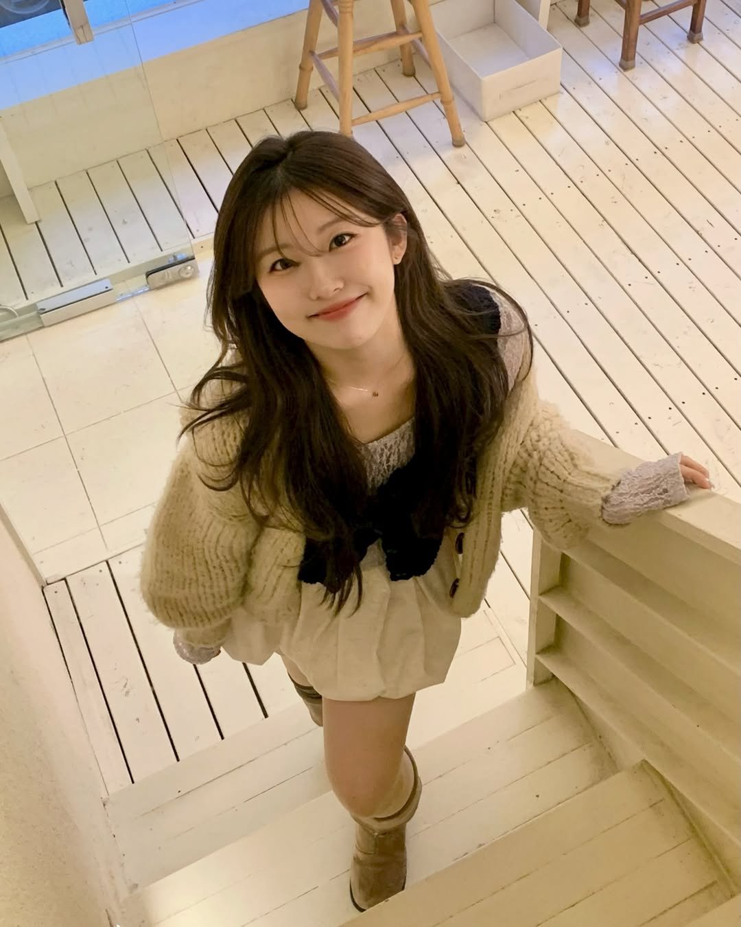 Photo by 나히 on December 29, 2025. May be an image of one or more people, hair, duffle coat, parka, miniskirt and text.