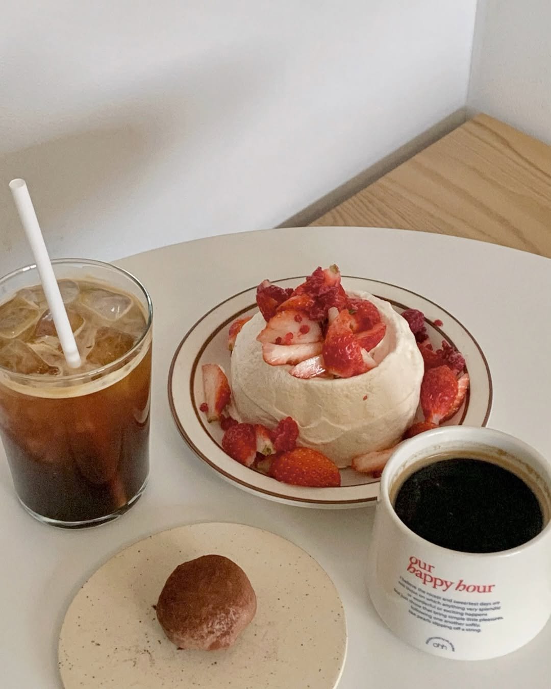 Photo by 나히 on December 11, 2025. May be an image of coconut macaroon, strawberry, coffee cup, cheesecake and text.
