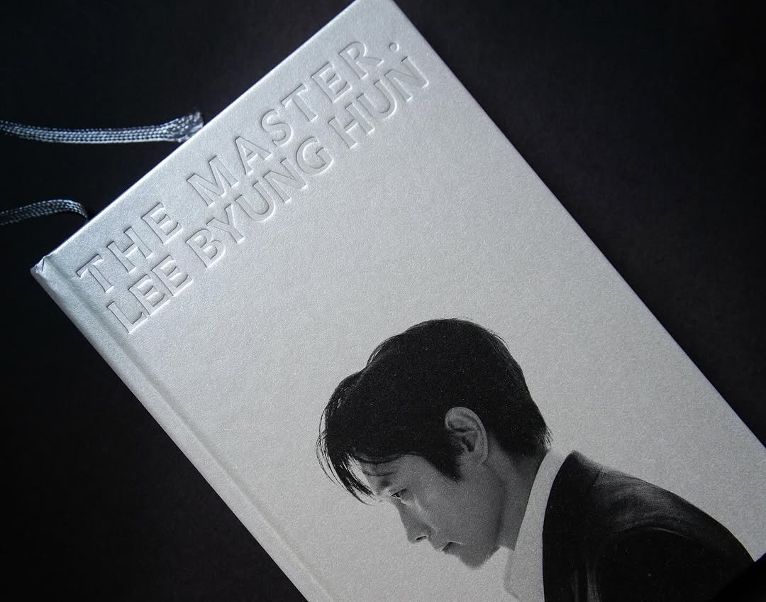 Photo shared by 6699press on July 06, 2025 tagging @bifanofficial, and @byunghun0712. May be an image of bolo tie and book.