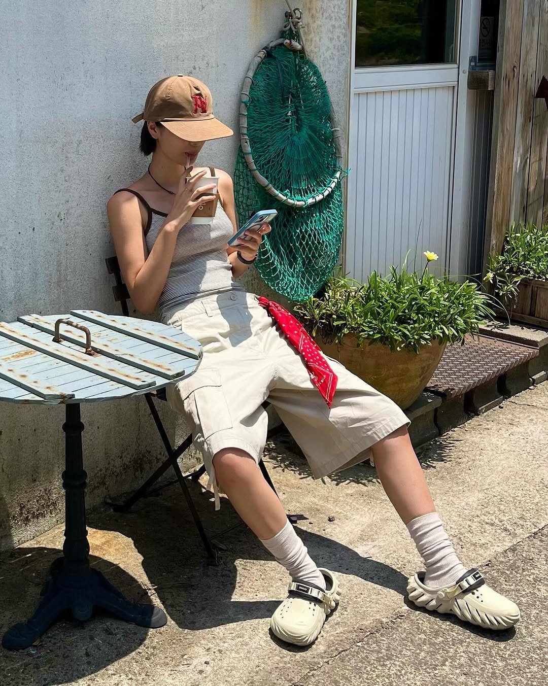 Photo by min on July 04, 2025. May be an image of 1 person, sparrow, ice cream, headscarf and text.