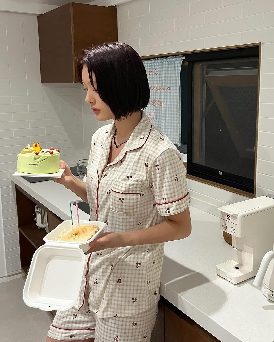 Photo by min on July 01, 2025. May be an image of 1 person, sleepwear, bath robe and text.