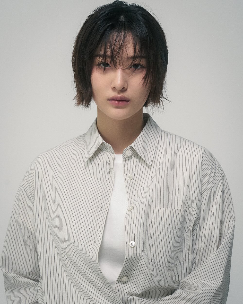 Photo by min on June 15, 2025. May be an image of 1 person, bangs, bolo tie and text.