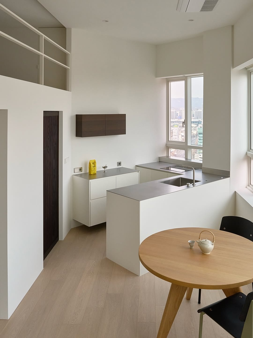 Photo shared by 팔십칠도씨 on February 23, 2026 tagging @nex_furniture_. May be an image of dining table, indoors, kitchen and text.