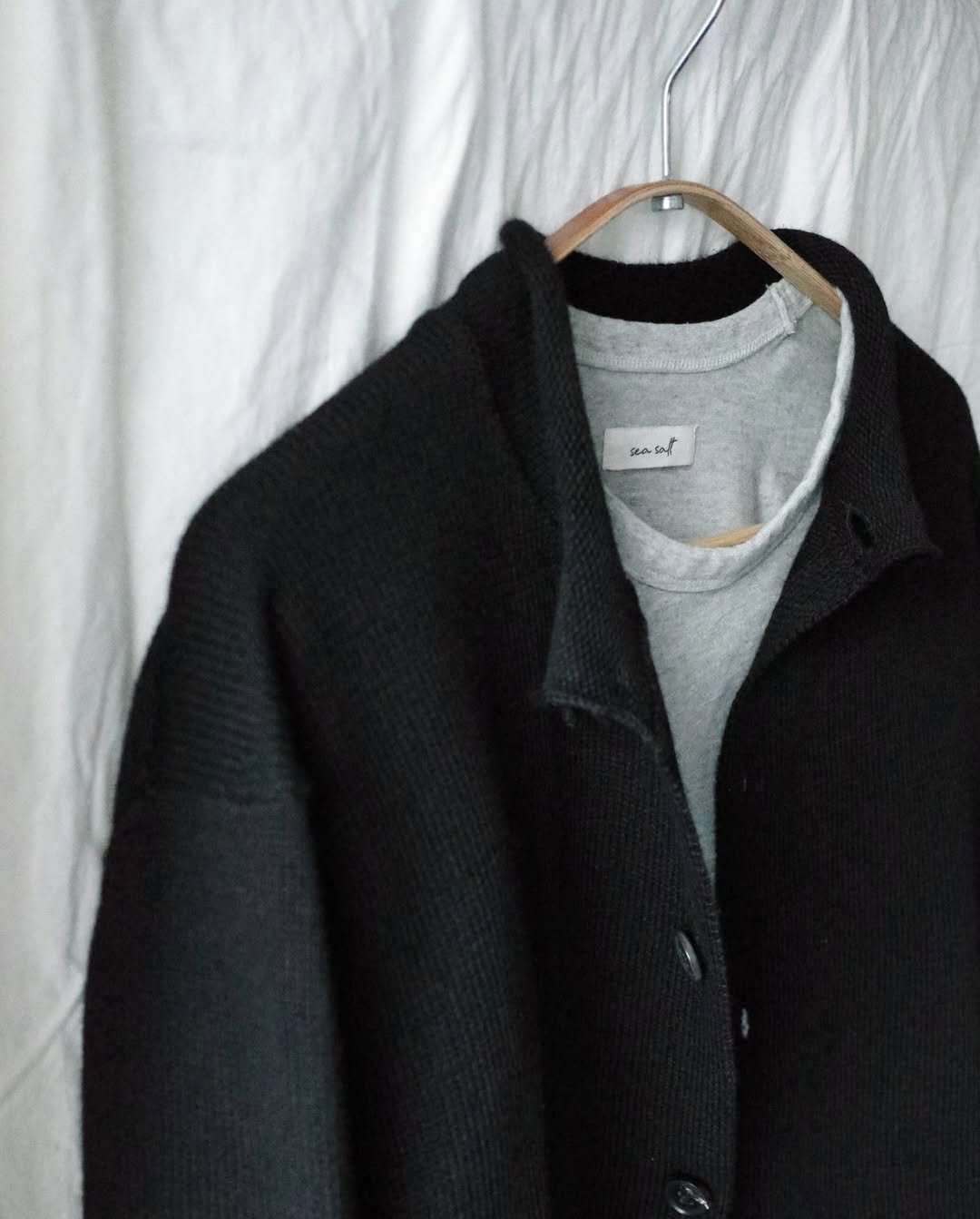 Photo shared by 8DIVISION on February 12, 2026 tagging @seasalt.contact. May be an image of duffle coat, overcoat, wool, cardigan, fleece and text.