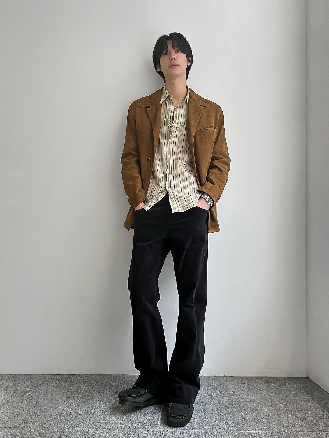 Photo shared by 8DIVISION on November 07, 2025 tagging @clarksoriginals, @northworksfolk, @hgbbstudio, @kaptainsunshine, and @surfaceedition. May be an image of duffle coat, overcoat, suit, wingtip shoes, blazer, bolo tie and text.