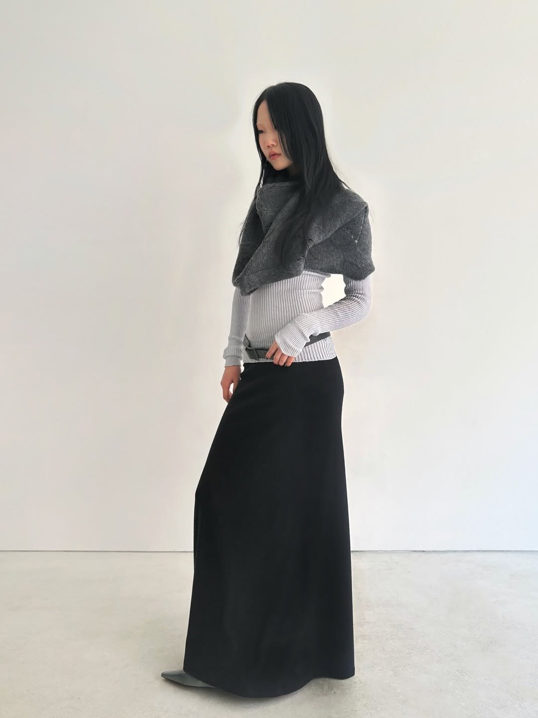 Photo shared by 8DIVISION on February 18, 2026 tagging @innirnet, @reveniomaker, @odlyworkshop, and @reposseoul. May be an image of scarf, headscarf, cloak, shawl and text.