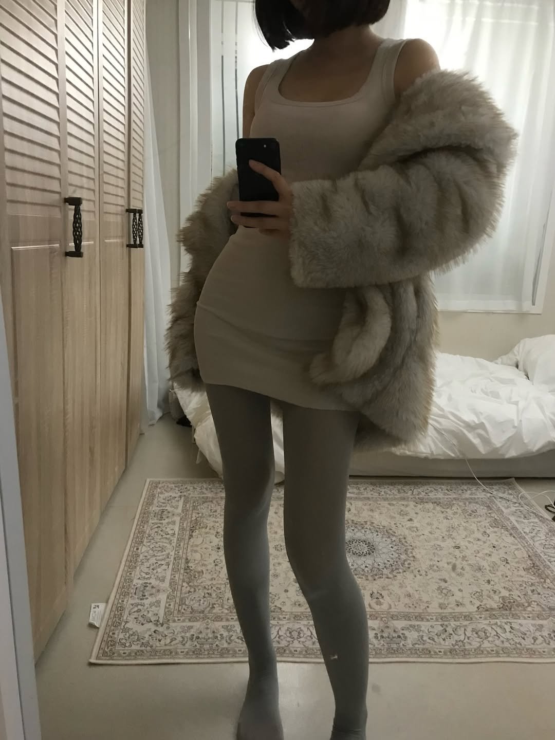 Photo by 백여경 on December 23, 2025. May be an image of sable coat, tights, parka and text.