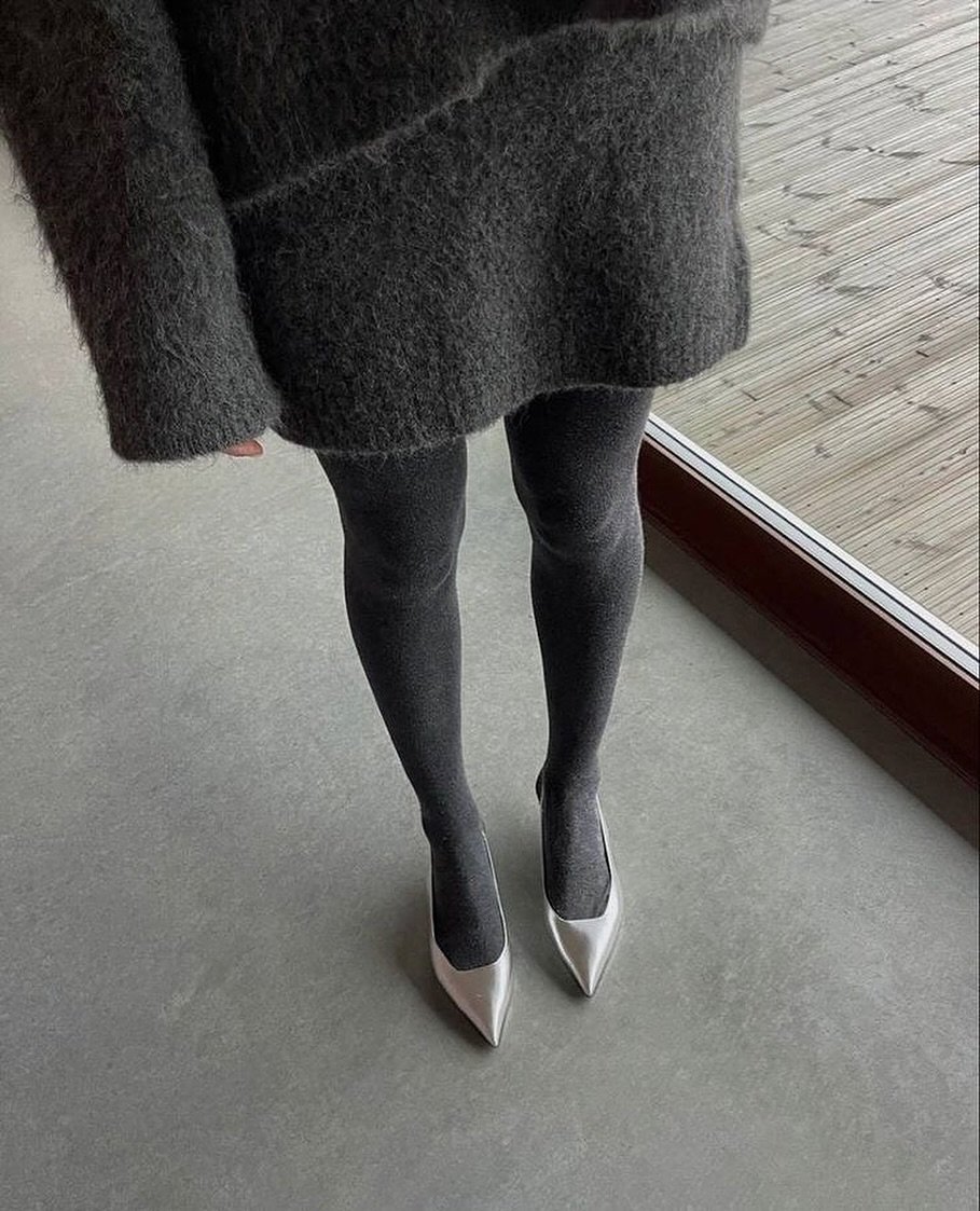 Photo by 백여경 on October 30, 2025. May be an image of high-heeled shoes, tights, wool, slingback shoes and text.