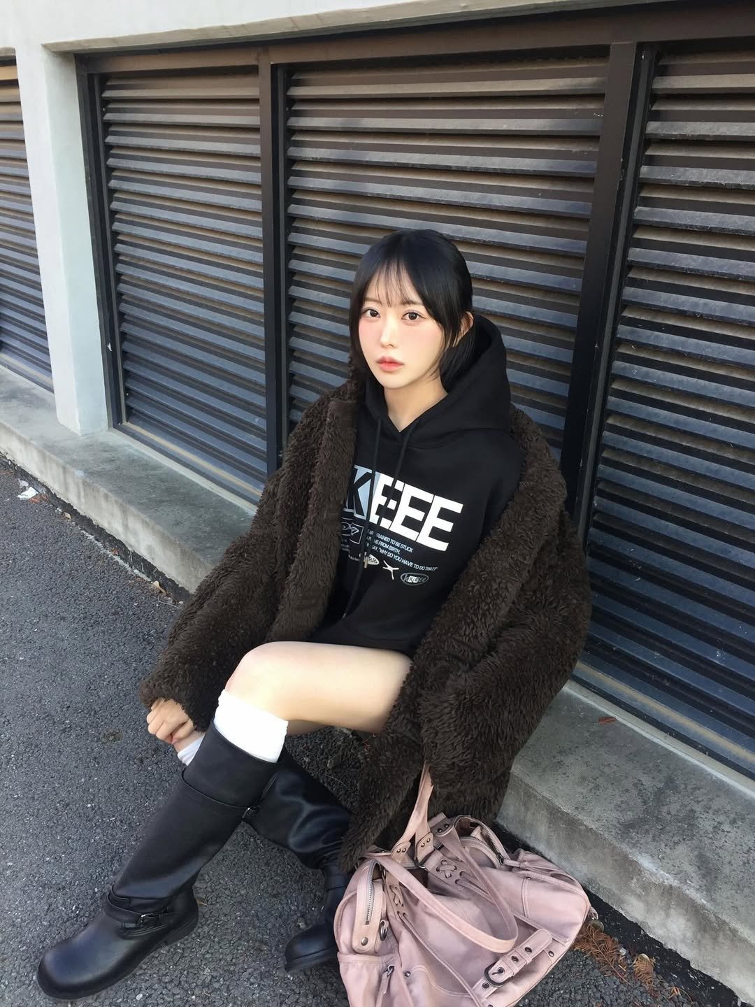 Photo shared by hee🍎 가희 on December 22, 2025 tagging @kkeee_official_. May be an image of duffle coat, overcoat, parka and text.