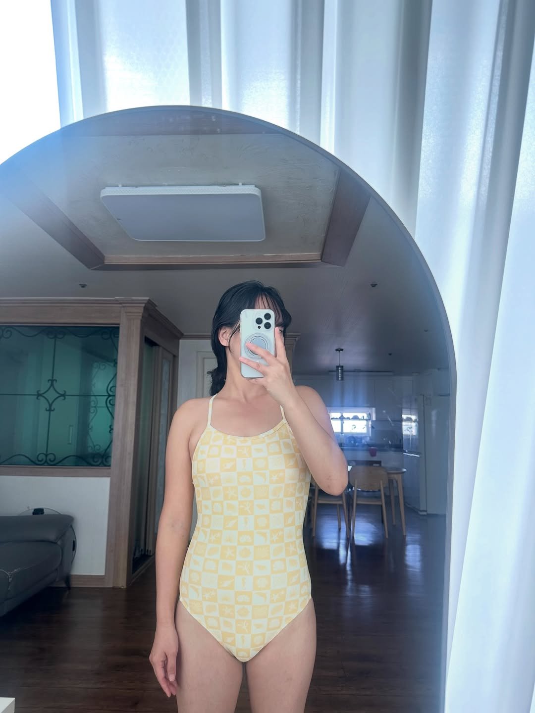 Photo by 콩이 on January 22, 2026. May be an image of wetsuit, halter top and text.