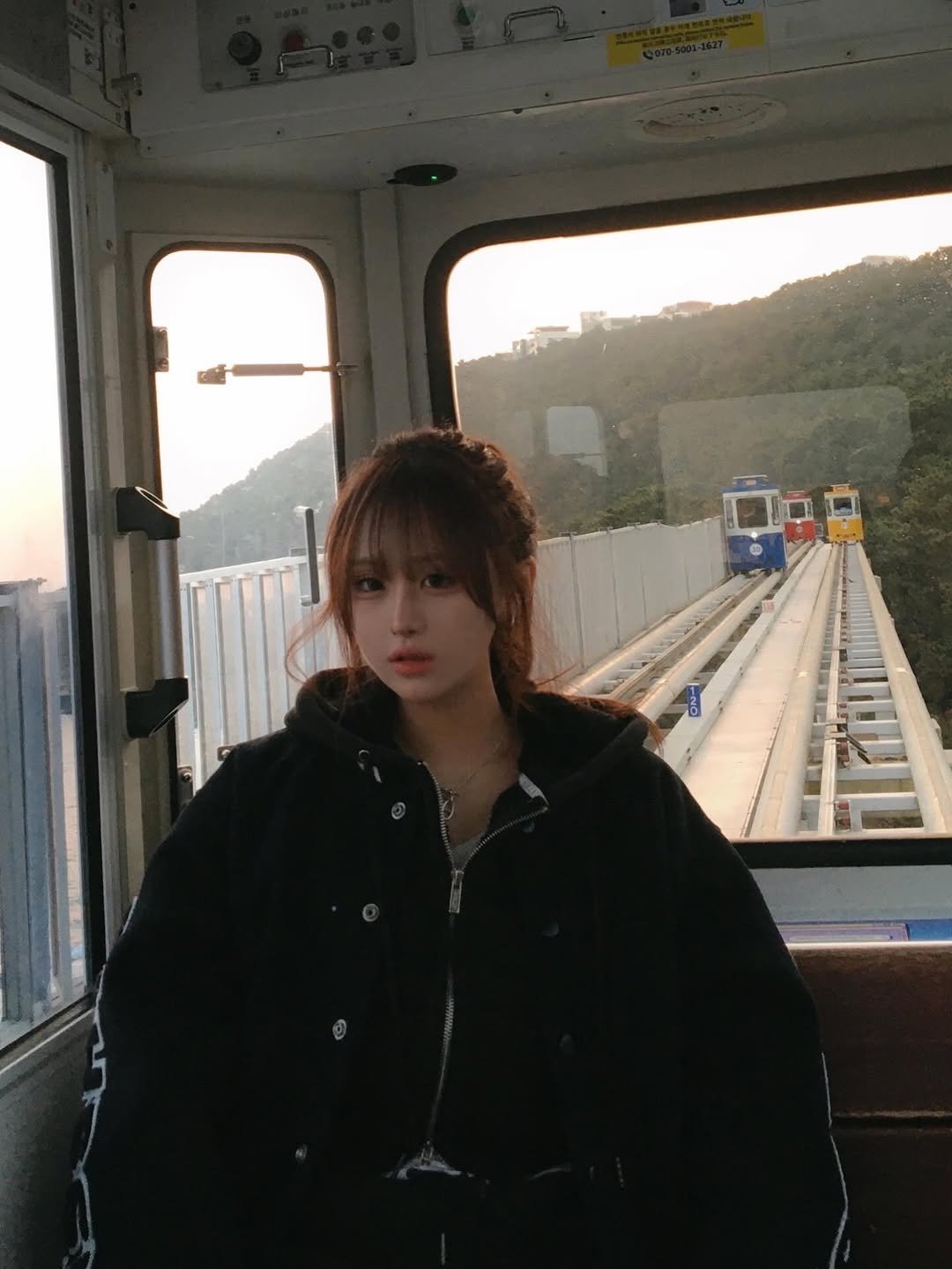 Photo by 하늬 on February 14, 2026. May be an image of train, cablecar, parka and text.