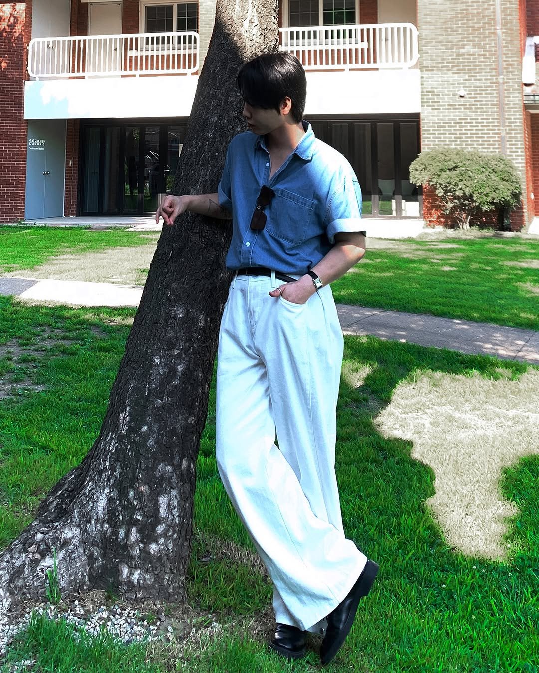 Photo shared by 이승훈 | 로사뷔노 on July 15, 2025 tagging @louisvuitton, and @rosavinofficial. May be an image of 1 person, standing, wingtip shoes, tree and text.