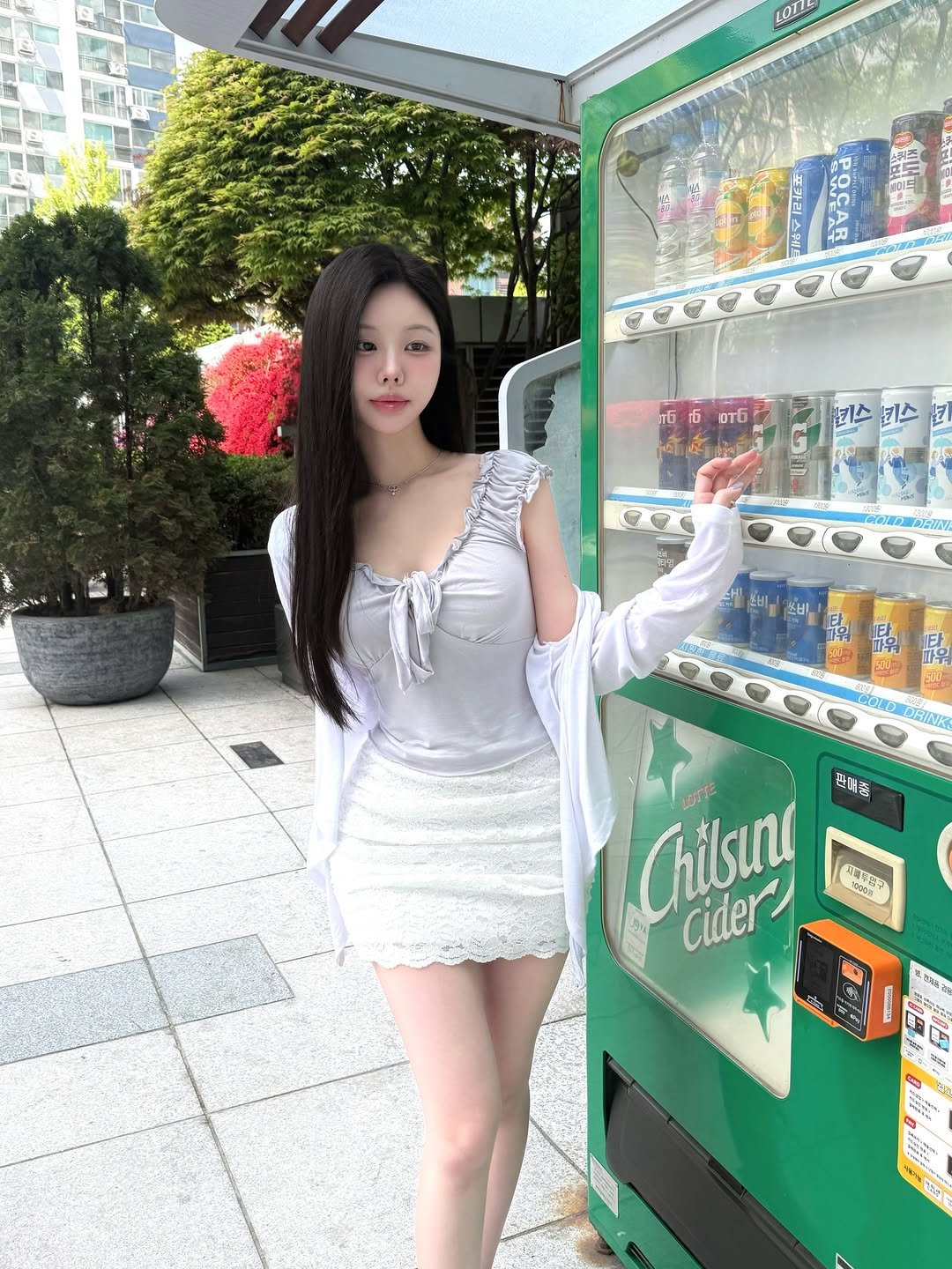 Photo shared by 정민 / 쉐입아워 on April 19, 2026 tagging @shape.our. May be an image of vending machine, miniskirt, newsstand and text.
