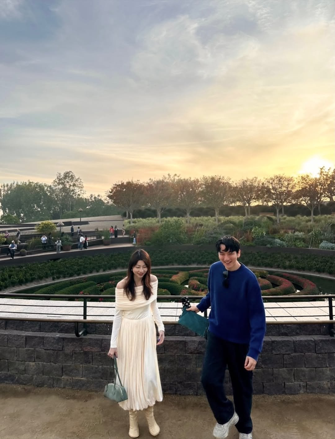 Photo shared by Yoontae Bang on December 25, 2025 tagging @lindasbang. May be an image of one or more people, twilight, park and text.