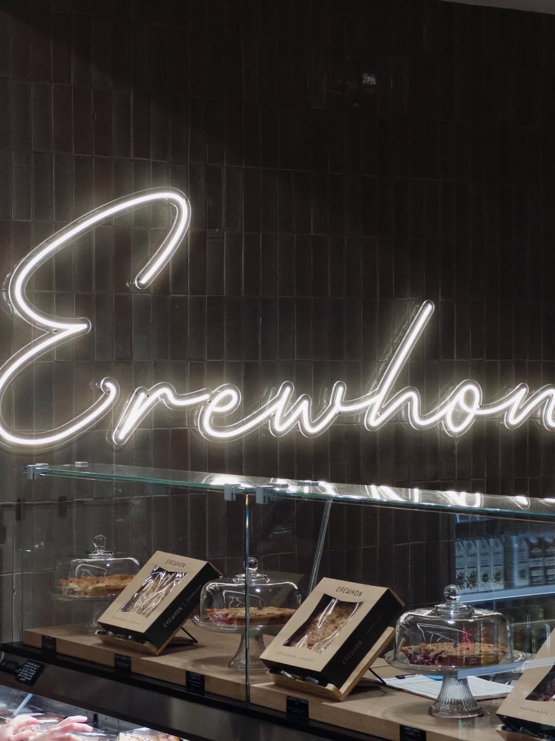 Photo shared by Yoontae Bang on December 17, 2025 tagging @erewhon. May be an image of lighting, display case, signboard and text.