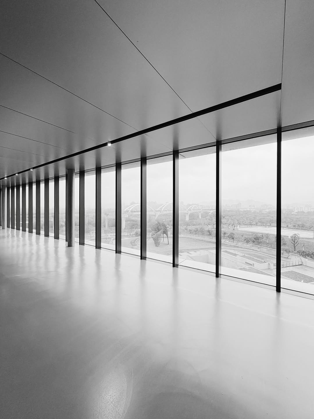 Photo by XEXH on January 22, 2026. May be a black-and-white image of hallway, buildings and text.