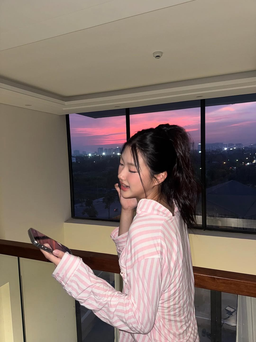 Photo by Julie 시연 on August 15, 2025. May be an image of 1 person, sleepwear, bath robe, horizon, twilight and text.