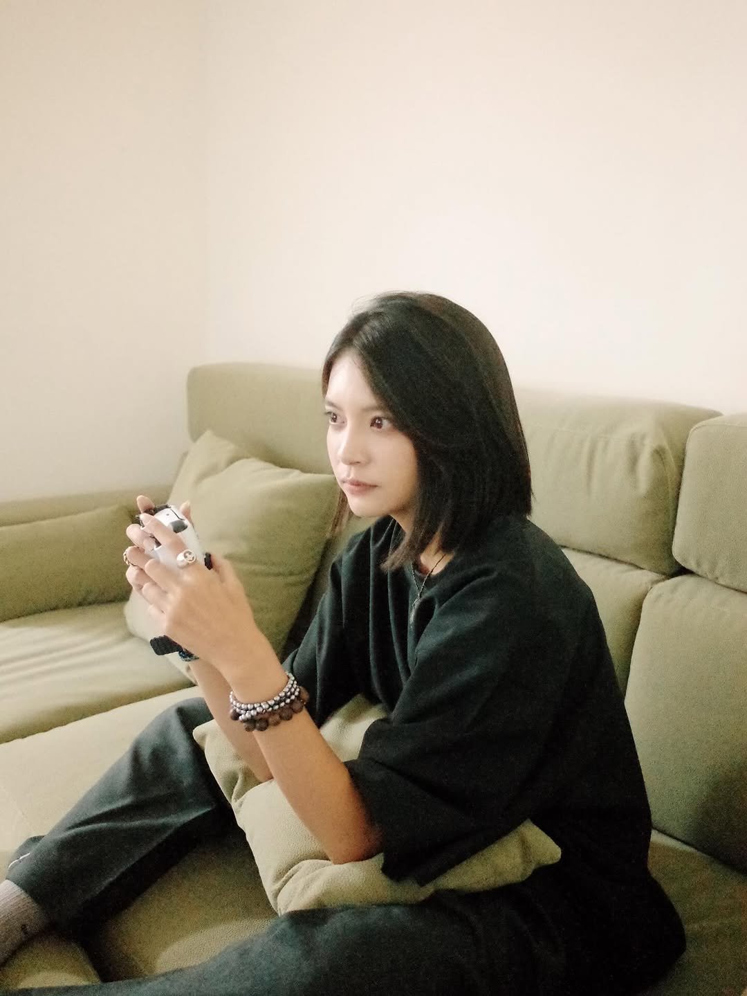 Photo shared by 曾珮晨 on September 17, 2025 tagging @sleepytofu_tw. May be an image of 1 person, hair, phone, cigarette and text.