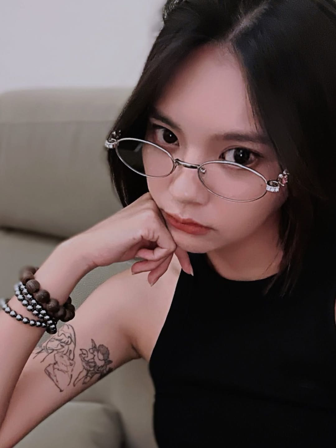 Photo by 曾珮晨 on September 04, 2025. May be an image of 1 person, hair, tattoo, eyeglasses and text.