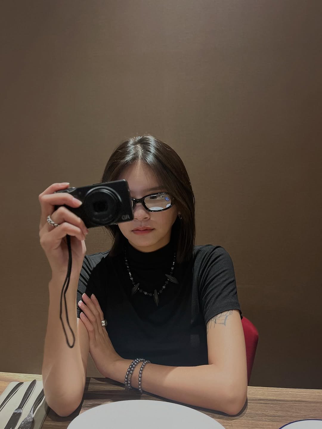 Photo by 曾珮晨 on October 06, 2025. May be a selfie of 1 person, phone, eyeglasses, camera, mirror and text.