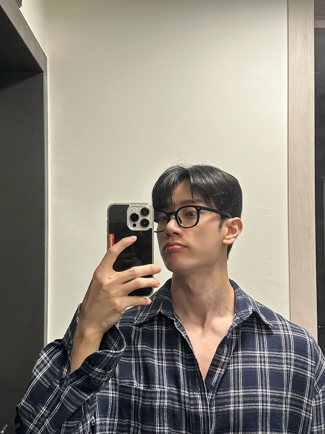 Photo by 김현중 on July 13, 2025. May be a selfie of 1 person, hair, eyeglasses, flannel, mirror and text.