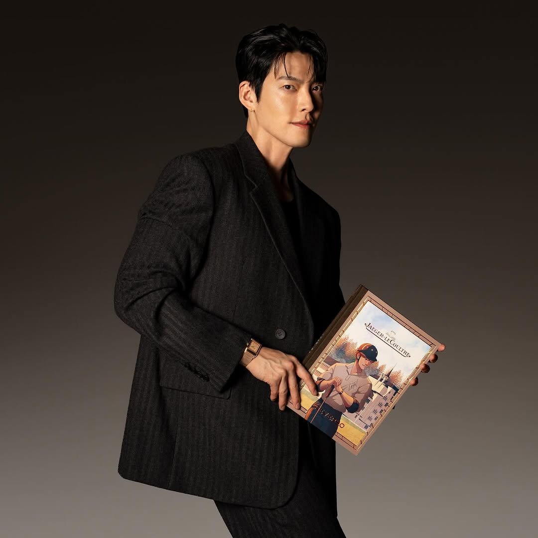Photo shared by 김우빈 on December 04, 2025 tagging @jaegerlecoultre. May be an image of poster and blazer.