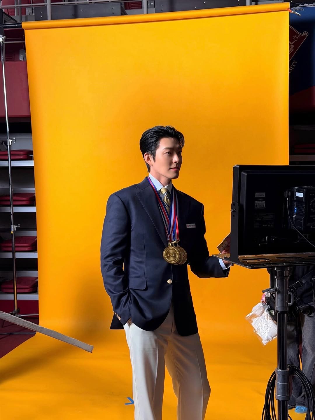 Photo shared by 김우빈 on February 14, 2026 tagging @kb_kookmincard. May be an image of suit, camera and text.